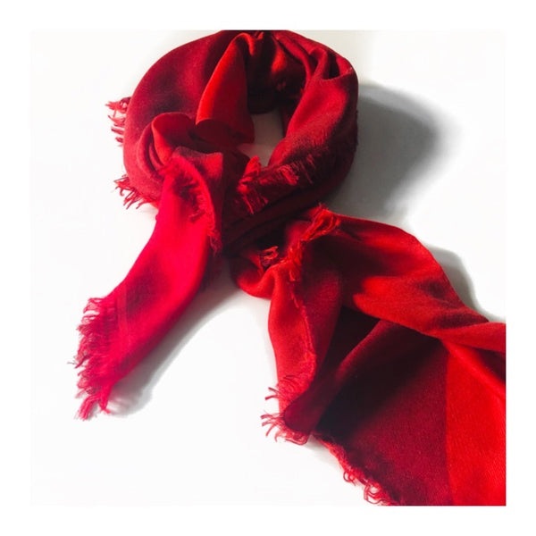 Thimpu 100% Cashmere scarf in vivid hues of red, inspired by a journey through Bhutan